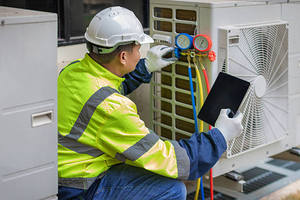 Professional Air Duct Cleaning technician working in Raymond, IL